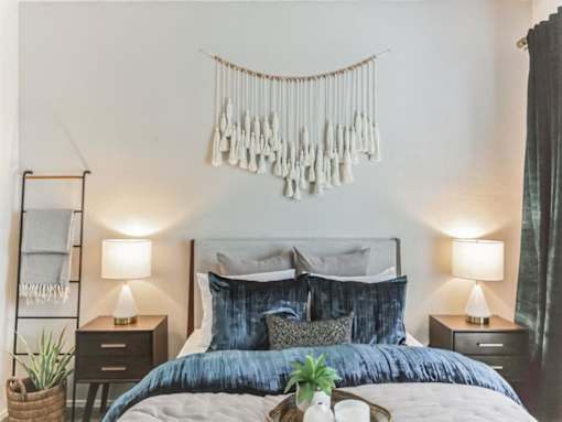 a bedroom with a bed and a decoration on the wall