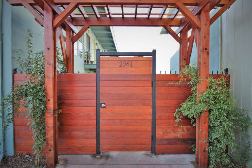 a wooden gate with a number on it