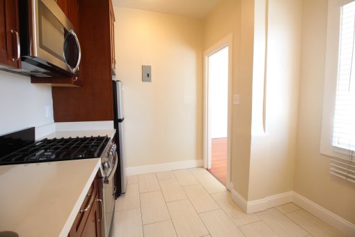 a kitchen with a stove and a microwave
