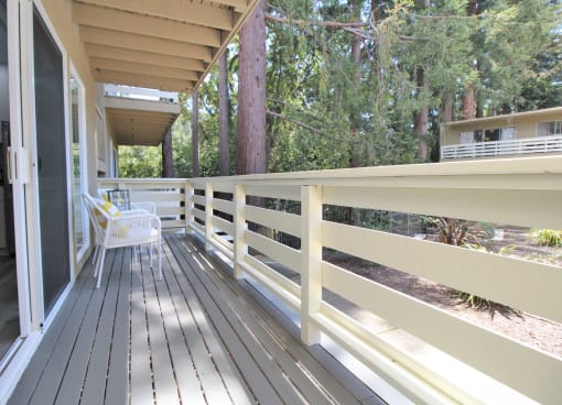a large deck with a chair on it