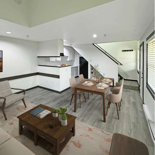 A modern dining room with a wooden table and chairs.