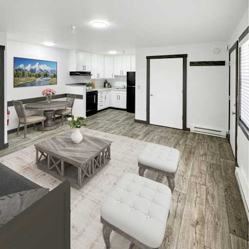 A modern kitchen with white cabinets and a painting of a mountain landscape on the wall.