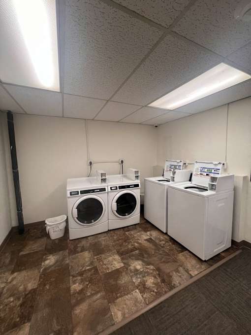 A laundry room with a washer and dryer.