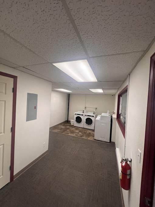 A laundry room with a washer and dryer.