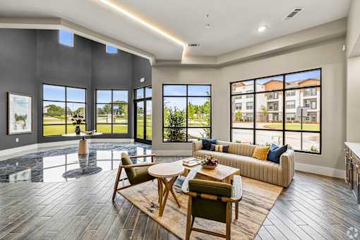 a living room with a couch and a table at Creekside at Grand Prairie, Grand Prairie, TX