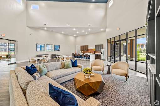 the preserve at ballantyne commons living room with couches and tables at Creekside at Grand Prairie, Grand Prairie, 75052