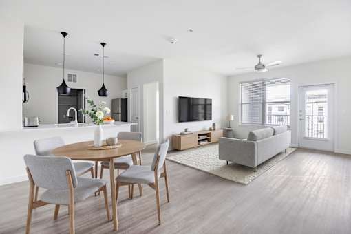 A modern dining room with a round table and grey chairs at 901 Rendon, Burleson, TX 76028