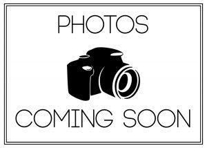A black and white image of a camera with the words 
