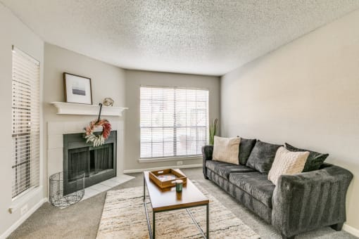 Living Room with Fireplace at Infinity on the Mark, Dallas, Texas