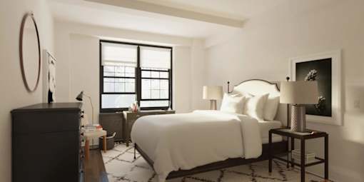 A bedroom with a large bed, a dresser, and a window with blinds.at London Terrace Gardens, New York 