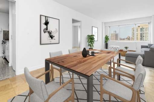 A modern dining room with a wooden table and grey chairs at The Caldwell Apartments, New York, 10028