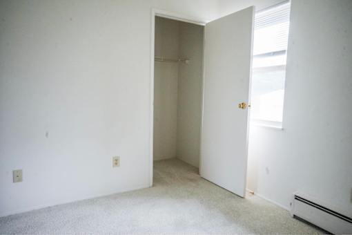 A room with a door and a window.