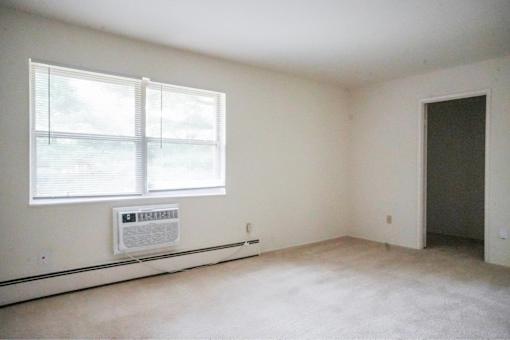 A room with a window and a door.
