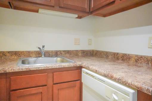 A sink and kitchen countertop.