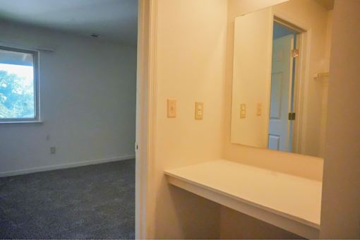 A room with a shelf.