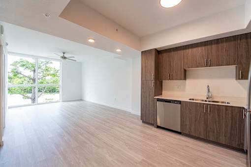 A kitchen with wooden cabinets and a white countertop.