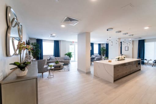 a lobby with a kitchen and a living room
