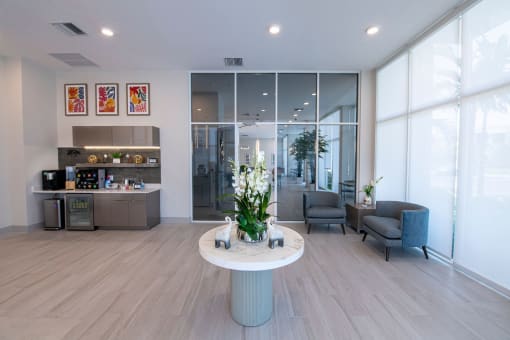 a lobby with a white table and chairs