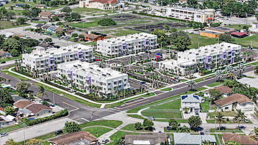 A view of a residential area with apartment buildings and houses.