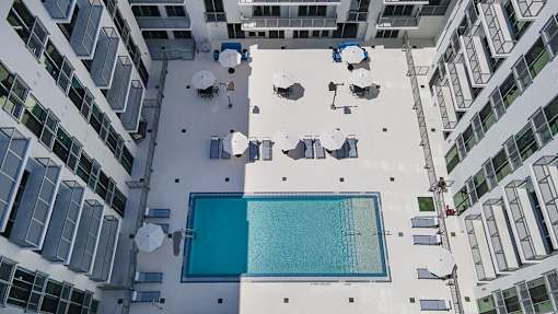 an overhead view of a resort style pool on a cruise ship