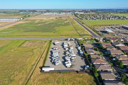 an aerial view of a parking lot full of boats