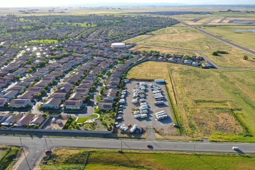 an aerial view of a parking lot full of cars