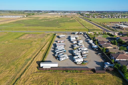 an aerial view of a parking lot full of cars