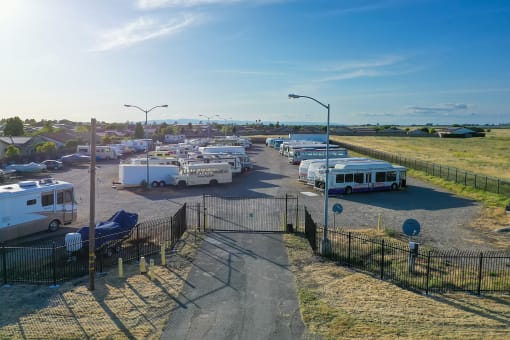 a group of buses parked in a parking lot