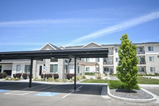 a parking lot in front of an apartment building