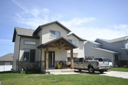 a truck parked in front of a house