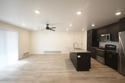 a kitchen and living room in a new home