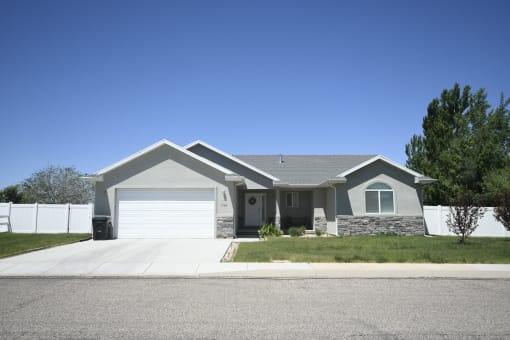 a house with a driveway and a garage door