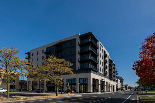 A modern multi-story building with a black and white exterior.
