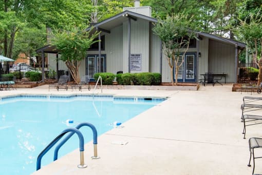 a swimming pool with a building in the background