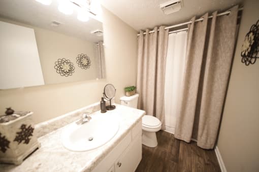 Spacious, landscaped outdoor terrace with lush seating, grills and a fire pit