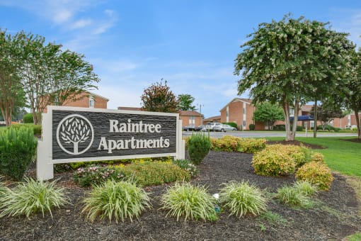 Spacious, landscaped outdoor terrace with lush seating, grills and a fire pit