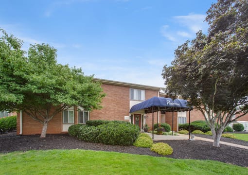 Spacious, landscaped outdoor terrace with lush seating, grills and a fire pit