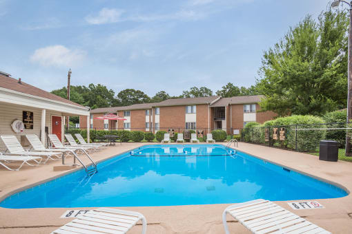Spacious, landscaped outdoor terrace with lush seating, grills and a fire pit