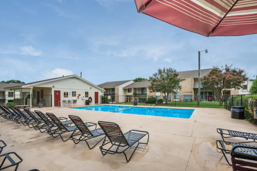 Spacious, landscaped outdoor terrace with lush seating, grills and a fire pit