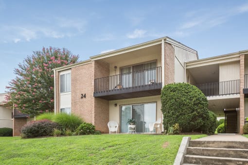 Spacious, landscaped outdoor terrace with lush seating, grills and a fire pit