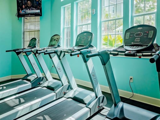 four treadmills in the apartment gym