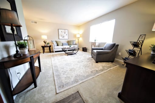 Spacious, landscaped outdoor terrace with lush seating, grills and a fire pit