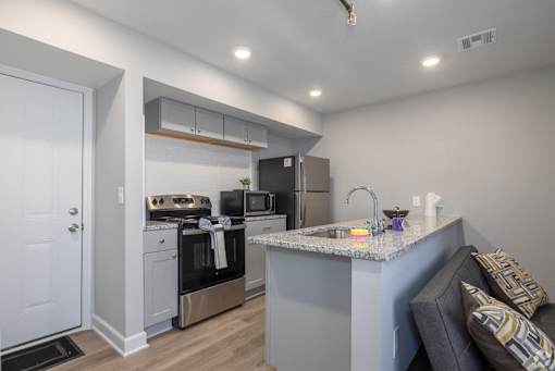 Kitchen with Stove at University Digs Apartments, Pittsburg, KS