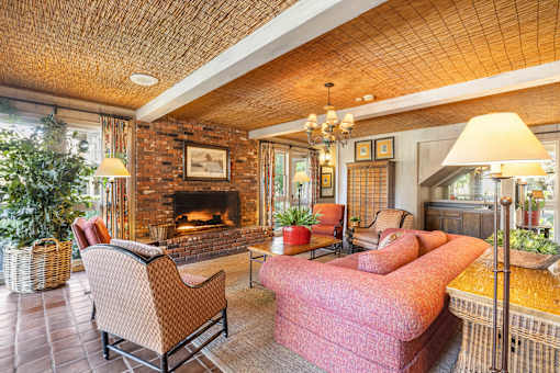 A living room with a fireplace and a couch at The Aspens Riverside, Riverside, 92504