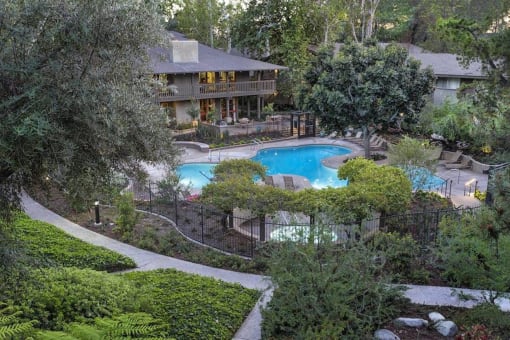 an aerial view of the clubhouse with a swimming pool