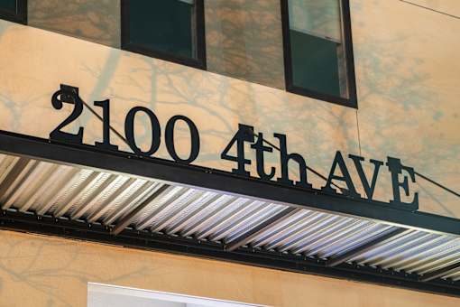 A building with a sign that says 2100 4th Ave.