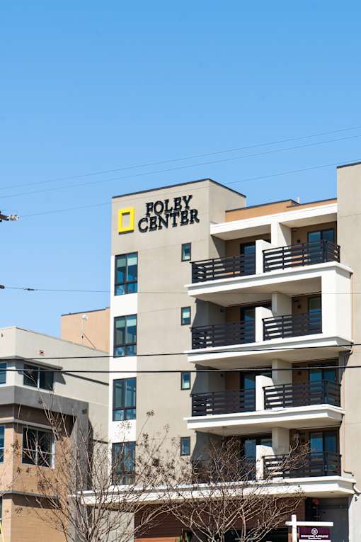 A building with a sign that says "Foley Center" on it.