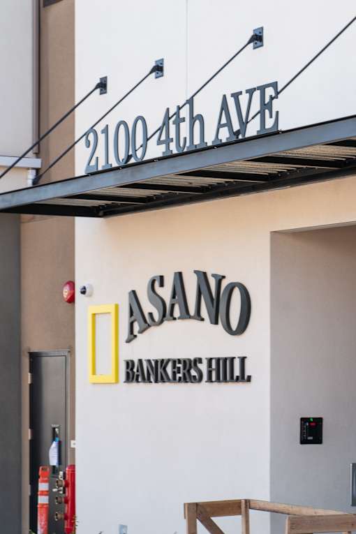 A wall with a sign that says Asano Bankers Hill.