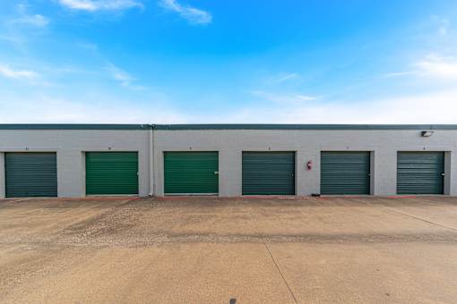 A row of garage doors are closed.