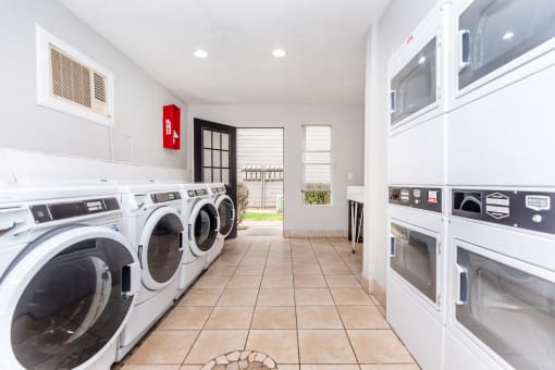 Laundry room at Royal Wildewood Manor Apartments, Clute, TX